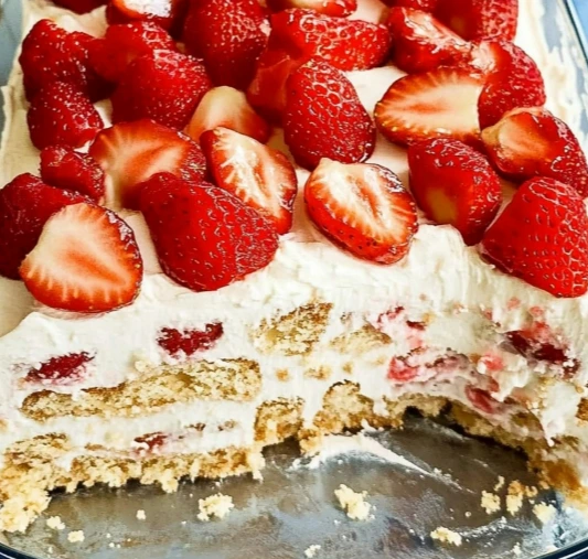Strawberry Icebox Cake with whipped cream and fresh berries