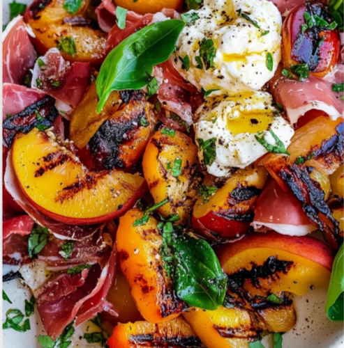 Nectarine Burrata Salad with prosciutto, arugula, and grilled fruit on a white serving platter